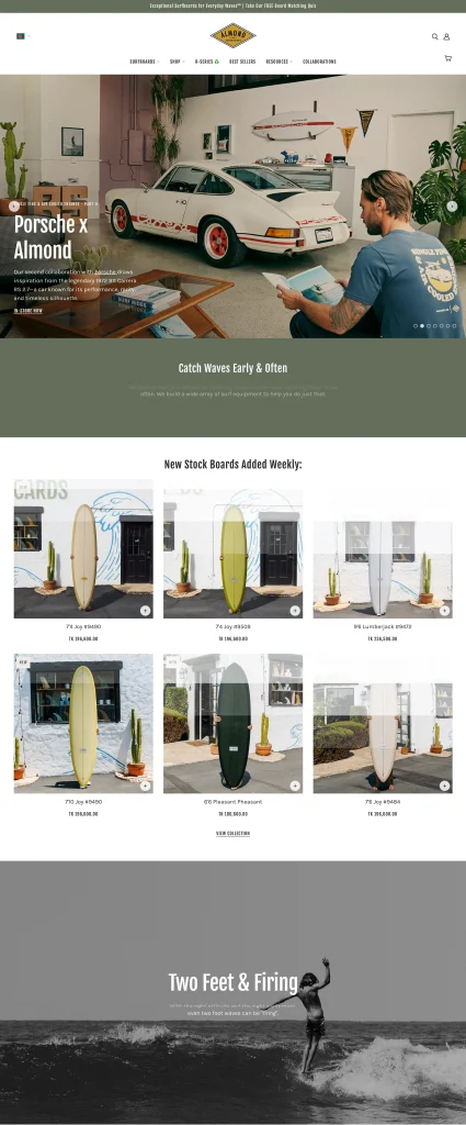 Almond Surfboards homepage showing vintage car with surfboard and surfer riding wave demonstrating aspirational lifestyle photography in ecommerce