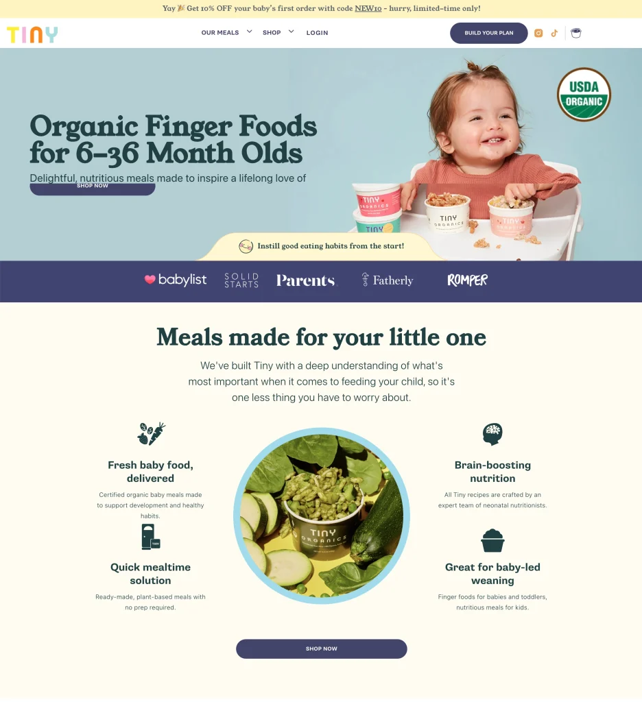Tiny Organics homepage hero section showing soft blue background with baby eating organic food, USDA Organic badge, and media trust logos demonstrating color psychology in ecommerce design